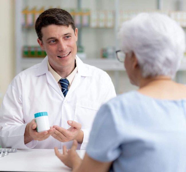 Caregiver Assisting with Medicine